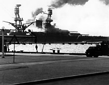 The burning Nevada on the way to the port exit