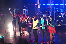 A concert performance by the main cast of the series in May 2011