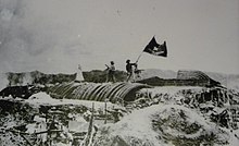 The Vietnamese flag flies over the French command bunker of Điện Biên Phủ.