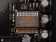 Integrated electronic circuit (chip, in the center of the picture) with analog-to-digital converters for converting analog audio signals into a digital data stream, here on a PC sound card.