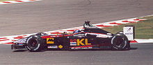 Mark Webber ajamassa Minardi PS02 -autoa Ranskan Grand Prix -kisassa 2002.  