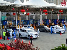 People check at the city border of Xi'an in central China's Shaanxi province, late January 2020.