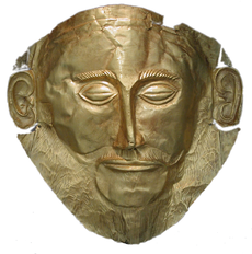 La máscara funeraria conocida como "Máscara de Agamenón". De oro, encontrada en la tumba V de Micenas por Heinrich Schliemann (1876), siglo XVI a.C. Museo Arqueológico Nacional, Atenas