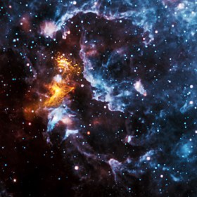  Hızla dönen bir nötron yıldızı olan PSR B1509-58 pulsarından gelen radyasyon, yakındaki gazın X-ışınlarında parlamasına neden olur (altın rengi, Chandra'dan) ve burada kızılötesinde görülen nebulanın geri kalanını aydınlatır (mavi ve kırmızı, WISE'dan)