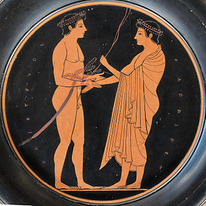 Lottatore e allenatore (o giudice) nella palaestra