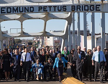 The Obamas, ex-President Bush, and civil rights activists march across the Edmund Pettus Bridge