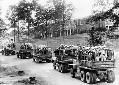 U.S. Army trucks drive across the University of Mississippi campus on October 3, 1962