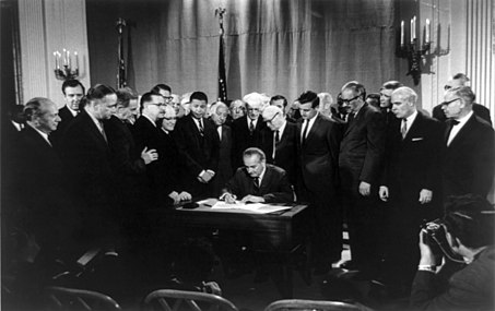 President Johnson signs the Civil Rights Act of 1968 into law