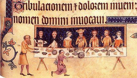 A 14th-century drawing of people eating. Scenes like this would have taken place in castles.[7]