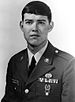 A black and white image of Hagemeister wearing his military dress uniform with ribbons and badges without a hat.