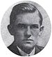 Round portrait of a young man dressed in a suit and with neatly combed hair.
