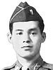 Head of a man wearing a garrison cap and a tie and shirt with a crossed-rifles pin on the collar.