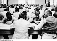 Prisoners eating (May 1933), propaganda photograph by Friedrich Bauer