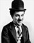 Charlie Chaplin, wearing a bowler hat