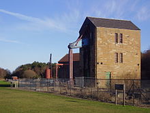 Pump house of a water lifting steam engine with balancer and pump rods