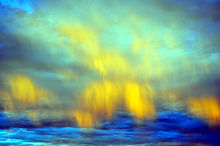 Downdrafts with accompanying virga form clouds that appear like aurora borealis in the eastern sky over the Mojave Desert at civil twilight.