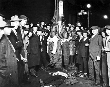 Lynchings also happened in the north. This postcard shows a lynching in Minnesota (1920)[19]