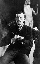 Edvard Munch in 1902 in the garden of the Linde Villa in Lübeck. In the background The Iron Age by Auguste Rodin.