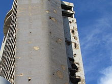 Holiday Inn Hotel damaged in the early phase of the war in 1975/76 during the so-called Hotel Battle in the centre.