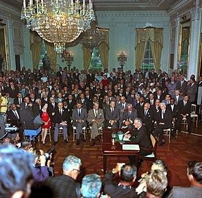 Johnson speaks to the media after signing the Act