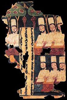 Manicheïsche priesters, die aan hun bureau schrijven, met een inscriptie in Oeigoer. Manuscript uit Khocho, Tarim Basin.