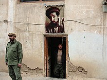 Portrait of Massoud at a checkpoint in the Punjir Valley .