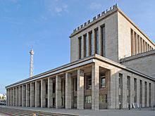 Main entrance of the Berlin exhibition grounds and the radio tower in Westend