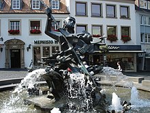 Neptune fountain by Josef Rikus in front of the cathedral