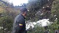 A rescue worker looking at the destroyed airplane.