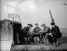 November 1939: Members of the British Expeditionary Force and the French Air Force in front of a hut marked "No. 10 Downing Street" (the address of the British Prime Minister).