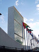 United Nations headquarters building, with flags in foreground